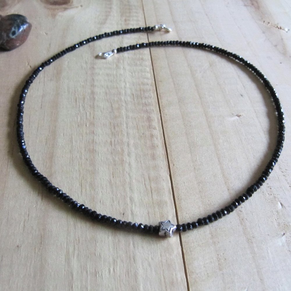 Black Spinel necklace with a little sterling silver flower